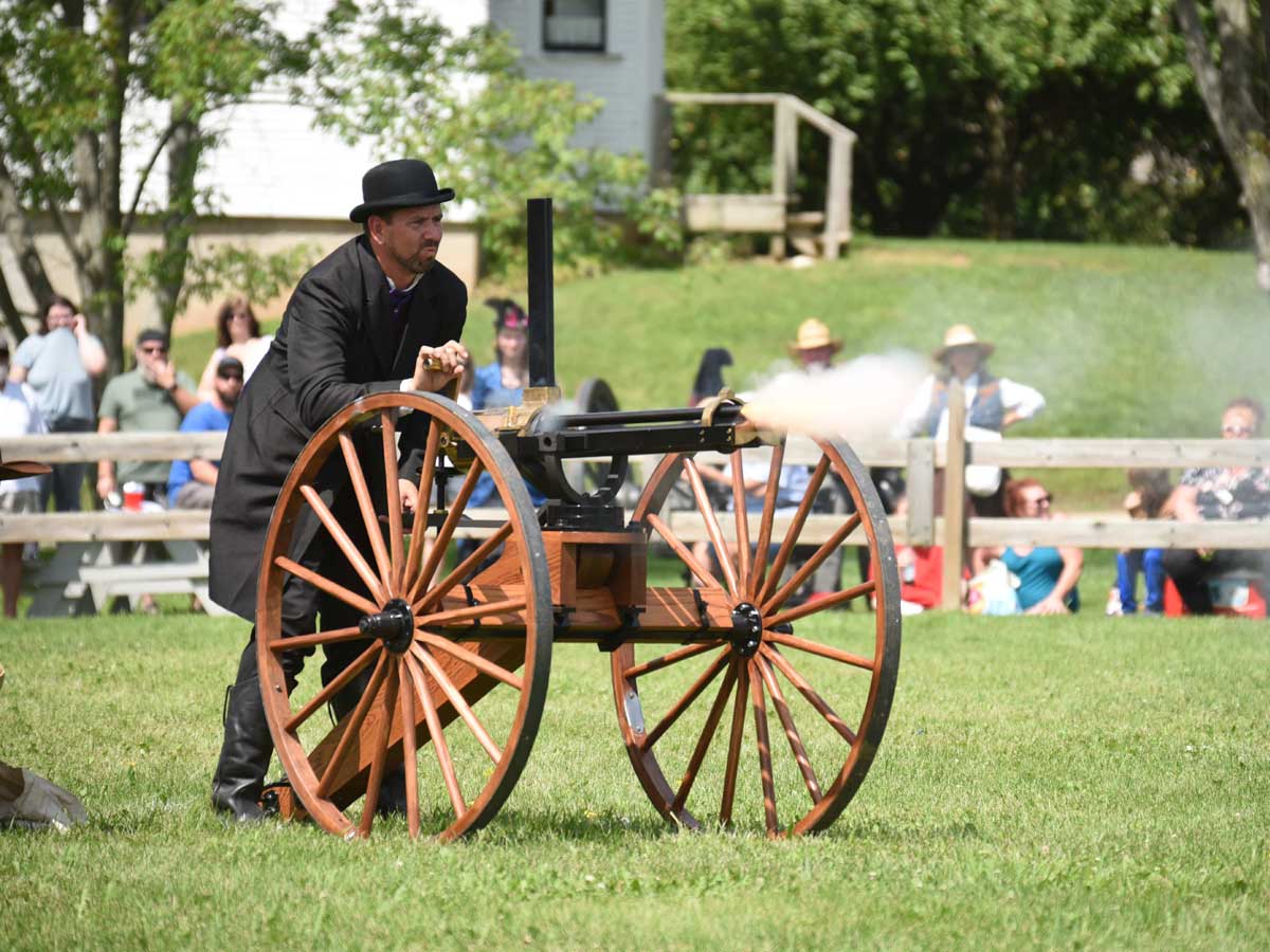 Man firing a cannon at the Buffalo Bill Wild West Show